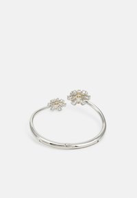 Silver bracelet with two floral motifs, featuring crystal accents and a smooth, polished surface. Simple, open design with no clasp.