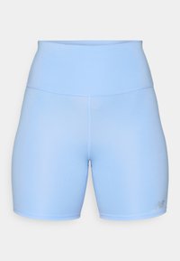 Light blue athletic shorts made of smooth, stretchy fabric. Features a high waistband and a small logo in the bottom right corner.