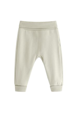 Beige babybukser med ribbede elastik i talje og kanter, lavet af blødt stof, designet for komfort og bevægelsesfrihed.