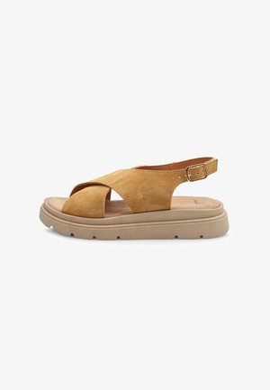 Sandali in suede giallo senape con design aperto, caratterizzati da cinturini incrociati, una fascetta sul retro e una robusta suola in gomma beige.
