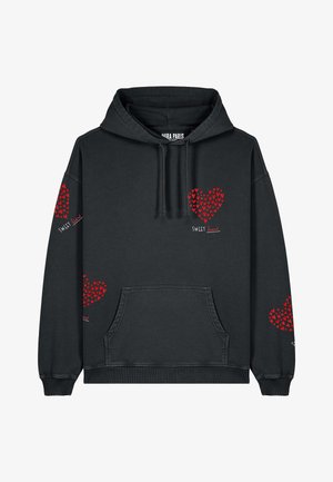 Felpa nera in cotone, con motivi a cuori rossi e testo ricamato "SWEET heart". Include una tasca a marsupio e orlo a coste.