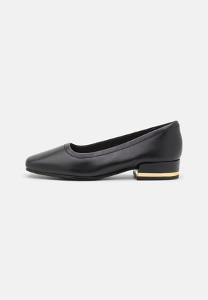 Black leather pump with a rounded toe and a low heel featuring a gold accent. Smooth texture, minimalistic design, and classic silhouette.