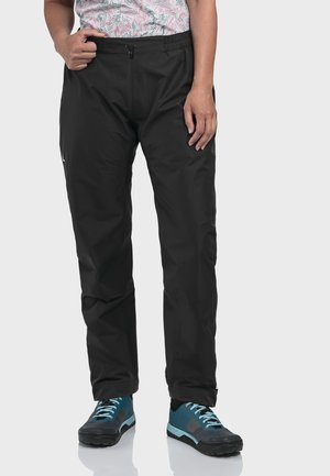 Schwarze wasserdichte Hose mit elastischem Bund und vorderem Reißverschluss. Glatte Textur, lockere Passform mit geraden Beinen. Mit einem Logo akzentuiert.