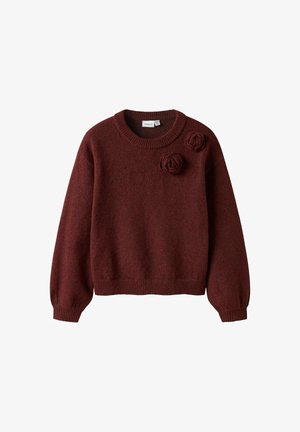 Vínový pletený svetr s kulatým výstřihem, dlouhými rukávy a dvěma dekorativními aplikacemi růží na levém rameni. Texturovaná tkanina.