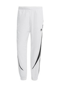 Vita joggingsbyxor med ett svart böjt randmönster, elastisk midja och anklar med muddar. Har en liten svart logotyp på den övre sidan.