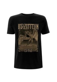 Black cotton t-shirt featuring a vintage gold graphic of an angel and "LED ZEPPELIN EST 1968" text. Short sleeves and crew neck design.