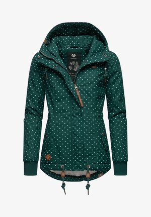 Groene jas met witte stippen, rits aan de voorkant, elastische manchetten, verstelbare capuchon en trekkoorden aan de onderkant. Bevat leren accenten.