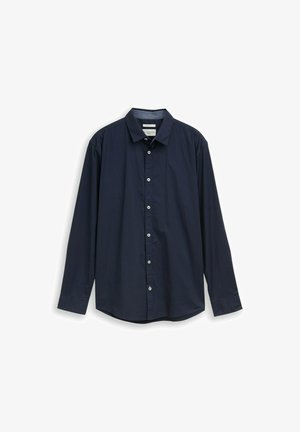 Chemise bleu marine à manches longues, boutonnée, avec col, présentée à plat sur un fond blanc.