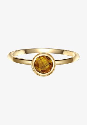 Bague en or avec une fine bande présentant une pierre précieuse d'ambre ronde et facettée, sertie dans un chaton lisse.