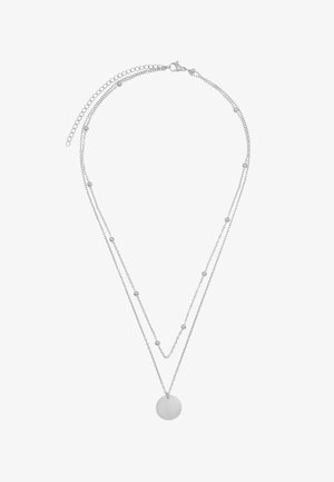 Srebrny naszyjnik dwuwarstwowy z delikatnymi łańcuszkami i małymi koralikami, z okrągłym wisiorkiem na środku. Gładka faktura, minimalistyczny design.