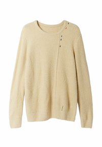 Pull en polaire couleur crème avec un col rond, des manches longues et une finition texturée. Présente des accents color és à pois sur un côté.