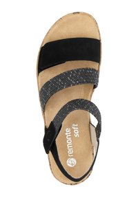 Sandale noire et grise avec un bon de liège, des sangles en velcro doubles et une tige en daim doux. Semelle intérieure marquée "remonte soft".