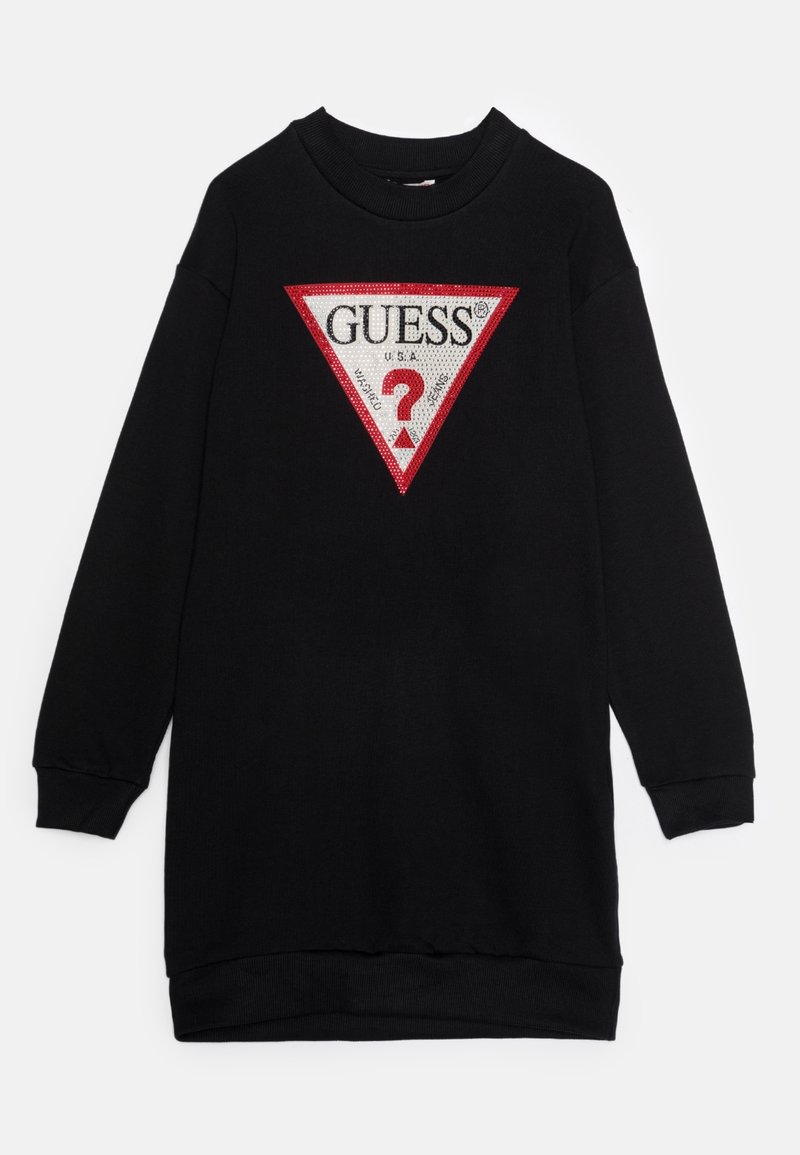 Svart sweatshirtklänning med en stor röd och vit triangel-logotyp med texten "GUESS?", tillverkad av mjukt material med ribbade ärmslut.