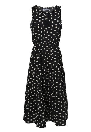 Vestido negro sin mangas con lunares blancos, escote con volantes, detalle de cordón ajustable y diseño de falda de varios niveles. Tela ligera.