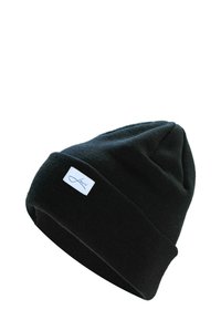 Schwarze Strickmütze mit umgeschlagenem Rand, versehen mit einem kleinen weißen Webetikett mit blauer Schrift. Weiche Textur, zylindrische Form.