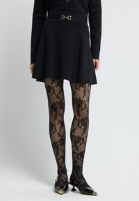 Falda acampanada - black