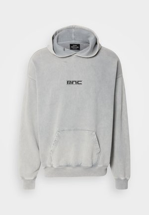 Light grey sweatshirt with a hood, front pocket, ribbed cuffs, and hem; features a black printed logo "mnc" on the chest. Cotton material.