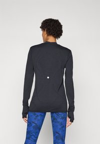 ASICS ROAD WINTER SEAMLESS TOP - Pitkähihainen paita - performance black