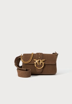 Brown suede handbag with a flap closure, gold-tone chain and bird motif hardware, adjustable strap with perforations, structured design.