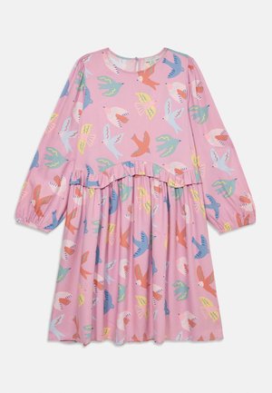 Pink long-sleeve dress with a ruffled waist, featuring a pattern of colorful birds in blue, yellow, and red against the pink fabric.