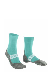 Para turkusowych i szarych skarpetek z białym logo marki na kostce oraz wyściełanymi podeszwami, umieszczonych na białym tle.