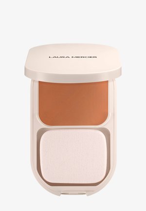 Poudre compacte de maquillage avec éponge applicatrice dans un boîtier beige, marque Laura Mercier visible sur le couvercle.