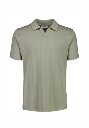 Polo à manches courtes en vert clair, avec un motif texturé et un design de col classique.