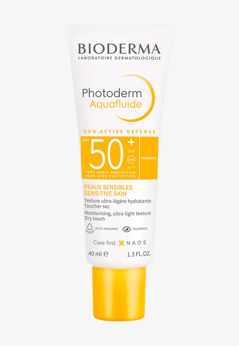 Tube de crème solaire avec fond blanc et accents jaunes. Contient un SPF 50+, une texture ultra-légère, une taille de 40 ml, et des informations en français et en anglais.