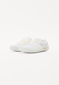 White athletic shoes with mesh panels, slip-on design, and textured rubber soles. Features subtle branding and a secure closure system.