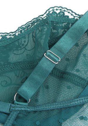 Teal lace fabric with floral patterns and mesh, featuring an adjustable strap with silver metal slider and ring.
