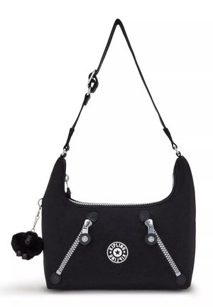 Black fabric shoulder bag with silver hardware, dual zippers, circular logo, and a detachable fur pompom keychain. Smooth texture, curved shape.