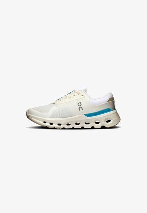 Lightweight running shoe in beige and white, featuring a mesh upper, blue accents, and a cushioned sole with visible ventilation holes.