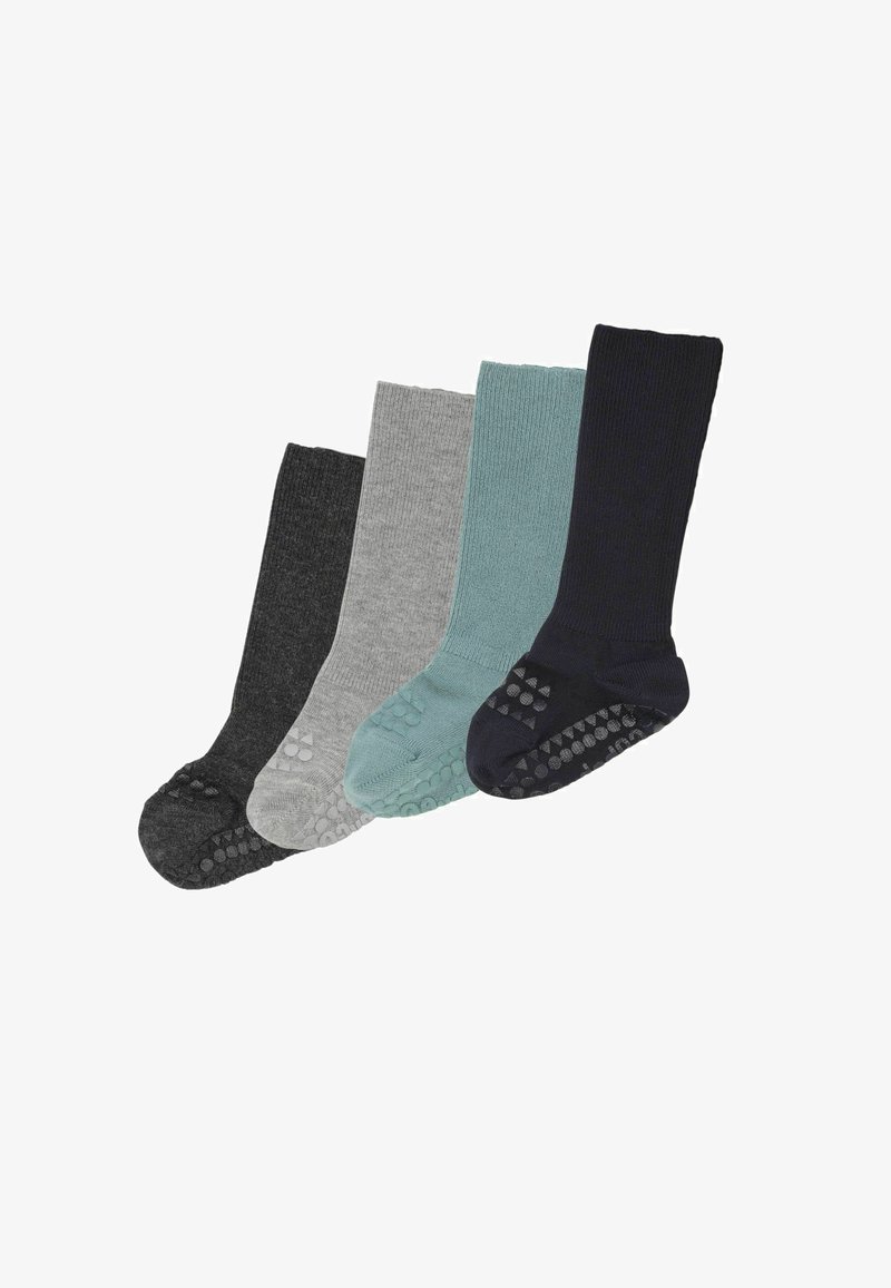 Quatre paires de chaussettes côtelées à grip antidérapant en gris foncé, gris clair, sarcelle et bleu marine, disposées côte à côte.