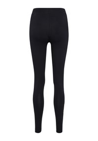 Zwarte legging met een gladde, rekbare textuur. Hoge tailleband en een aansluitende pasvorm, minimale details en een subtiel logo aan de zijkant.