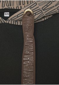 Black hooded garment featuring a brown drawstring with raised lettering and a gold-toned metal grommet. Inner hood has a patterned fabric.