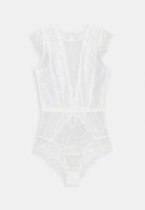 Lace bodysuit in white featuring floral patterns, scalloped edges, a deep V-neck, and a fitted silhouette with a hook-and-eye closure.