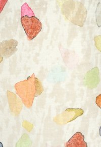 Light fabric with a textured surface featuring irregular multicolored shapes in shades of pink, orange, blue, green, and yellow on a beige background.