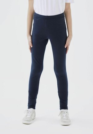 Marineblaue Leggings aus dehnbarem Baumwollmischgewebe. Sie haben eine hohe Taille und ein schlankes, enganliegendes Design, das bis zu den Knöcheln reicht.
