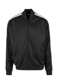 Veste bomber en satin noir avec fermeture éclair sur le devant, col et poignets côtelés, présentant des accents rayés blancs le long des épaules.