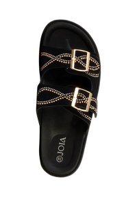 Sandale noire à talon plat avec deux boucles dorées et motifs décoratifs de clous dorés et argentés sur les brides, taille 38.