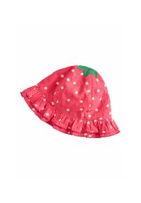 Pink bucket hat with white polka dots, ruffled brim, and a green leaf-shaped detail on top resembling a strawberry.