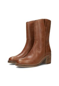 Botas de tobillo de cuero marrón con punta redonda, detalles de costura sutiles y un tacón apilado. El diseño cuenta con paneles laterales elásticos para facilitar su uso.