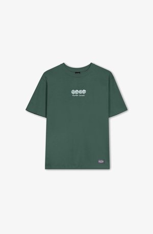 Green cotton t-shirt with short sleeves, round neck, and front graphic text "Karaoke Society." Features a small brand label on the hem.