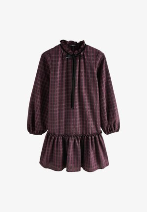 Vaherpunane kleit voltis kaelusega, laiad pikad varrukad ja kihiline seelik. Omab ruudumustrit ning musta paela detaili.