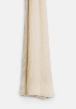 Szydełkowy kremowy szalik o prążkowanej fakturze, w kształcie długiego prostokąta z zagiętymi brzegami. Miękki materiał z subtelnymi odcieniami.