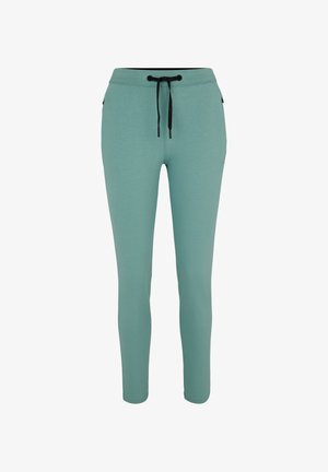 Mint green sweatpants with a drawstring waistband, slim fit, two side pockets, and a small logo accent on the left leg. Soft fabric texture.