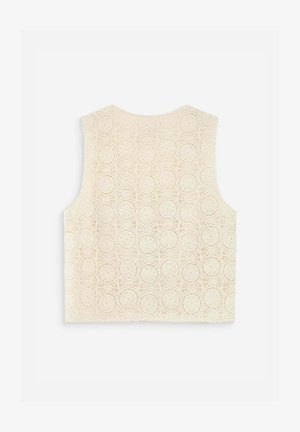 Ærmeløs cremefarvet hæklebluse med cirkulært mønster, brede skulderstropper og lige kant, vist på en hvid baggrund.