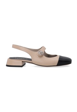 Beige leather slingback shoe with a black toe cap, features a jewel-like accent on the strap and a low, square heel.