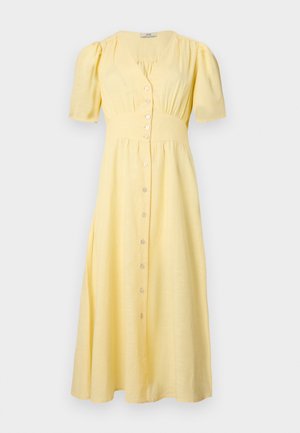 Kollane midi kleit lühikeste pööratud varrukatega, nööpidega esiküljel, liibuv vöökoht ja kogutud kangaste detailid rinna- ja seelikualal.