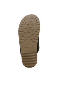 Zwarte schoenzool met een getextureerde tan rubberen loopvlak, voorzien van multidirectionele groeven en kruispatronen. VIONIC-logo zichtbaar aan de zijkant.